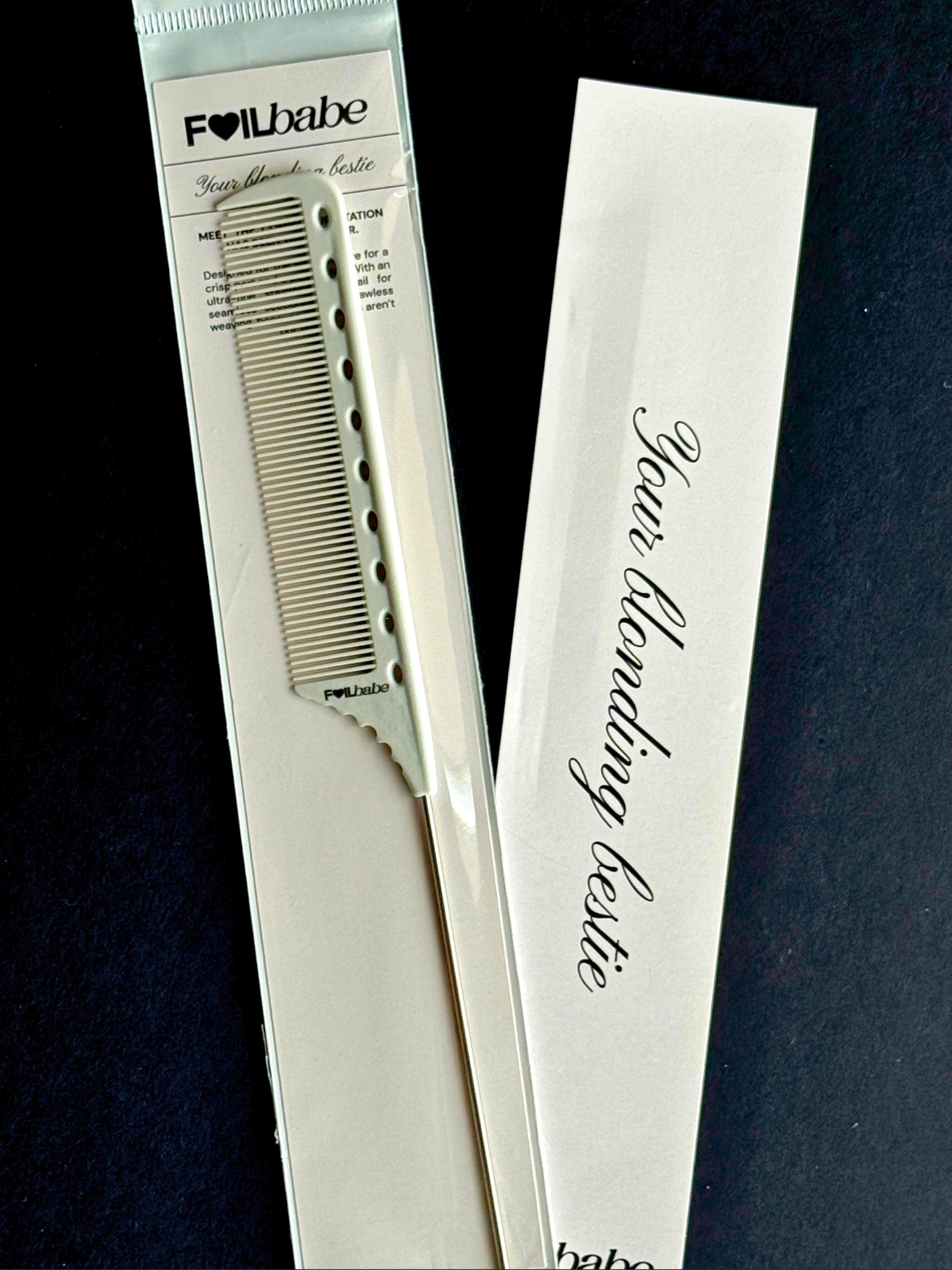 Hair blonding comb with packaging on a dark background