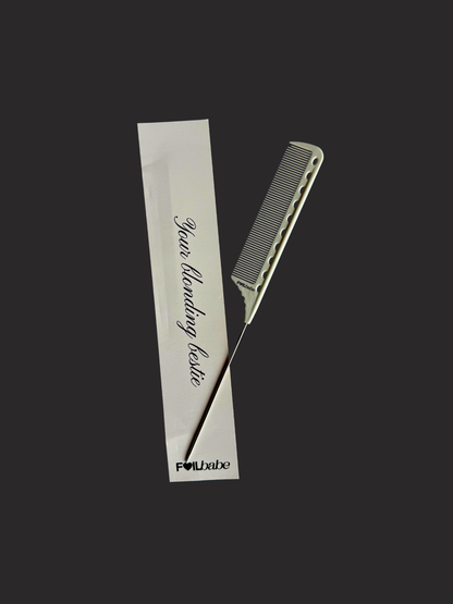 Hair comb and styling tool with a branded card on a black background
